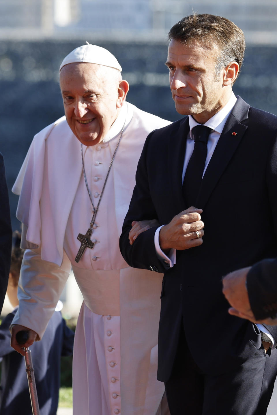 French President Emmanuel Macron arrives with Pope Francis at the final session of the "Rencontres Mediterraneennes" meeting at the Palais du Pharo, in Marseille, southern France, Saturday, Sept. 23, 2023. Francis, during a two-day visit, will join Catholic bishops from the Mediterranean region on discussions that will largely focus on migration. (Sebastien Nogier, Pool via AP)