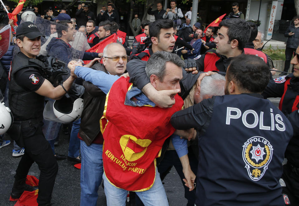 <p>Police scuffle with demonstrators during May Day protests in Istanbul, Turkey, May 1, 2018. Workers and activists mark May Day with defiant rallies and marches for better pay and working conditions. (Photo: Lefteris Pitarakis/AP) </p>