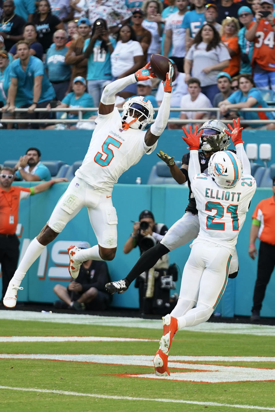 Miami Dolphins cornerback Jalen Ramsey (5) intercepts a pass in the end ozone intended for Las Vegas Raiders wide receiver Tre Tucker (11) during the second half of an NFL football game, Sunday, Nov. 19, 2023, in Miami Gardens, Fla. The Dolphins defeated the Raiders 20-13. (AP Photo/Wilfredo Lee )