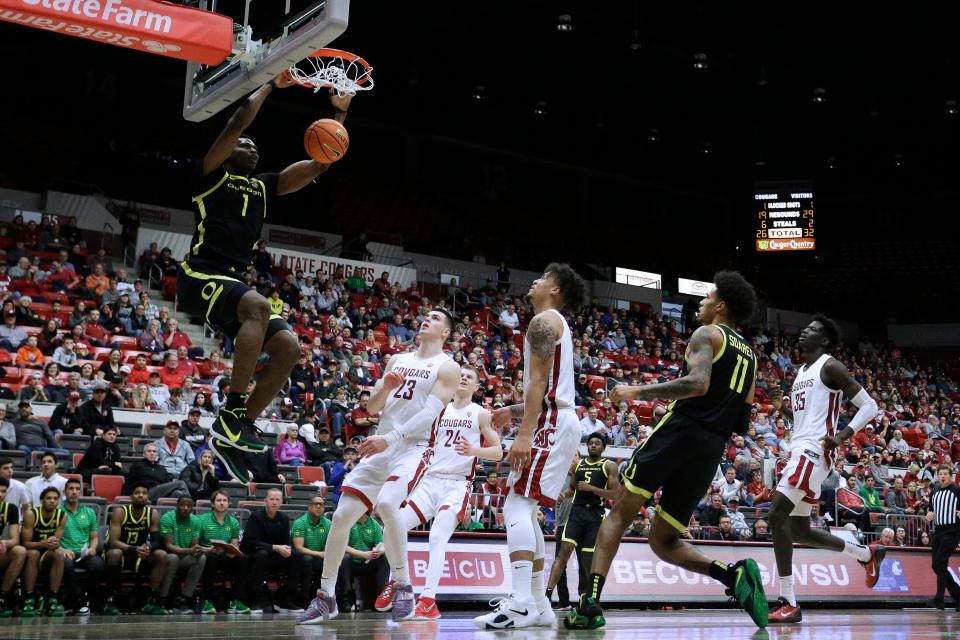 Oregon center N'Faly Dante (1) dunks during the second half of the game against Washington State, Sunday, Feb. 19, 2023, in Pullman, Wash.