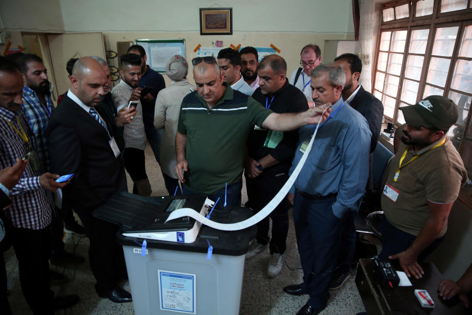 <p>Iraq’s Independent High Electoral Commission employee closes a ballot box at a polling station during the parliamentary election in Baghdad, Iraq, May 12, 2018. (Photo: Abdullah Dhiaa al-Deen/Reuters) </p>