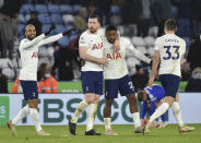 Tottenham's Lucas Moura, left, Tottenham's Pierre-Emile Hojbjerg,Tottenham's Steven Bergwijn,Tottenham's Ben Davies celebrate their victory during the English Premier League soccer match between Leicester City and Tottenham Hotspur at King Power stadium in Leicester, England, Wednesday, Jan. 19, 2022. (AP Photo/Rui Vieira)