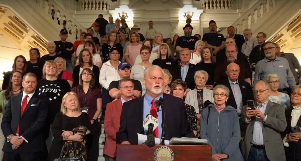 UnitePA leader Sam Faddis speaks at the capitol rotunda in Harrisburg on May 11, 2022, introducing his group's declaration calling on lawmakers to end mail-in voting allowed by Act 77. The group behind him represented over 50 groups that have since become the Pennsylvania Patriots Coalition.