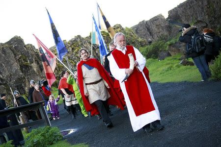 High priest of the Asatru Association, Hilmar Orn Hilmarsson, leads a procession of fellow members of the Asatru Association, a contemporary Icelandic pagan society, at the Pingvellir National Park near Reykjavik June 21, 2012. REUTERS/Silke Schurack