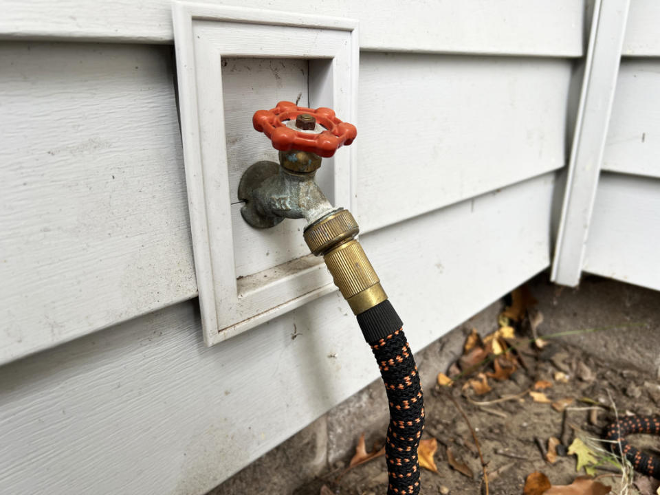 A garden hose and spigot.<p>Emily Fazio</p>