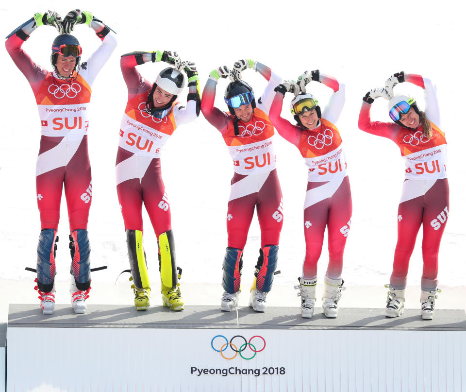 <p>Gold medallists Switzerland with (L-R) Ramon Zenhaeusern, Daniel Yule, Luca Aerni, Wendy Holdener and Denise Feierabend celebrate during the victory ceremony for the Alpine Team Event Big Final on day 15 of the PyeongChang 2018 Winter Olympic Games at Yongpyong Alpine Centre on February 24, 2018 in Pyeongchang-gun, South Korea. (Photo by Tom Pennington/Getty Images) </p>