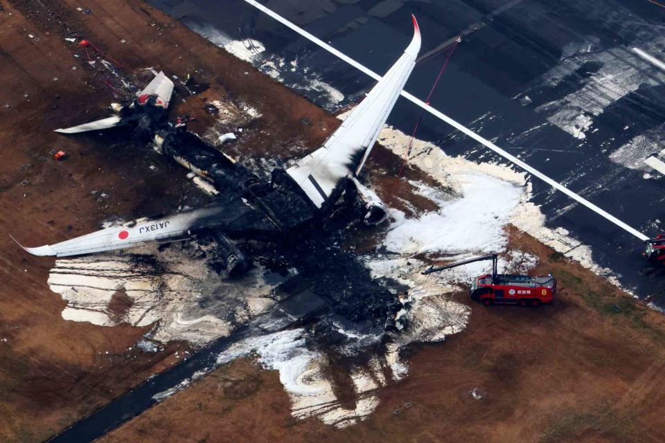 <p>The Yomiuri Shimbun via AP Images</p> An aerial photo shows Japan Airlines flight 516 burnt on the runway at Haneda Airport in Ota Ward, Tokyo on Jan. 3, 2024