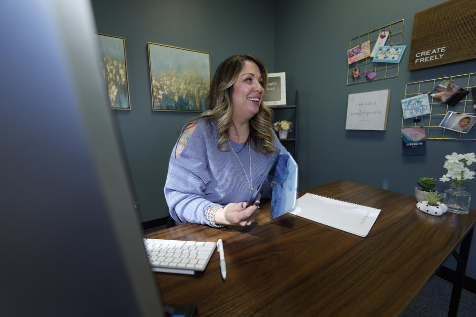 Web designer Lorie Smith poses in her office on Monday, Nov. 7, 2022, in the southwest part of Littleton, Colo. (AP Photo/David Zalubowski)