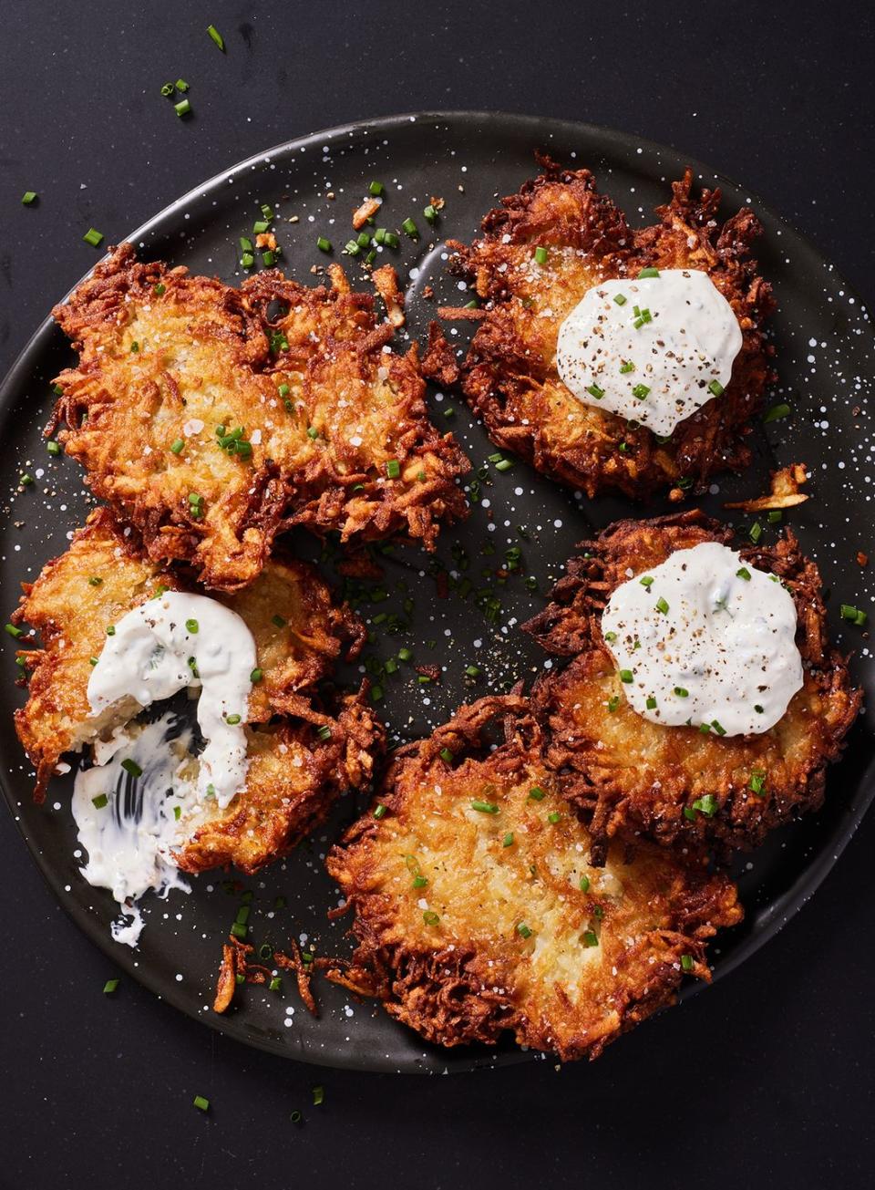 <p>Though <a href="https://www.delish.com/holiday-recipes/hanukkah/a34772139/hanukkah-latkes/" rel="nofollow noopener" target="_blank" data-ylk="slk:latkes;elm:context_link;itc:0;sec:content-canvas" class="link ">latkes</a> are commonly served with <a href="https://www.delish.com/cooking/recipe-ideas/a28848550/instant-pot-applesauce-recipe/" rel="nofollow noopener" target="_blank" data-ylk="slk:applesauce;elm:context_link;itc:0;sec:content-canvas" class="link ">applesauce</a> and plain sour cream, here, they get a flavor-boost with a spicy horseradish and chive sour cream topping, which adds savory depth to each bite.</p><p>Get the <strong><a href="http://www.delish.com/cooking/recipe-ideas/a39493185/house-latkes-with-horseradish-recipe/" rel="nofollow noopener" target="_blank" data-ylk="slk:House Latkes With Horseradish recipe;elm:context_link;itc:0;sec:content-canvas" class="link ">House Latkes With Horseradish recipe</a></strong>.</p>