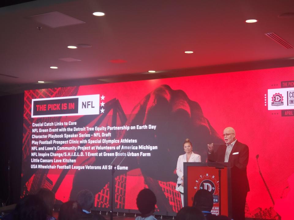 Wayne County Executive Warren Evans speaks to attendees at the April 22 Community Impact Draft at The Corner Ballpark as NFL Senior Manager of Community Relations Christina Hovestadt listens.