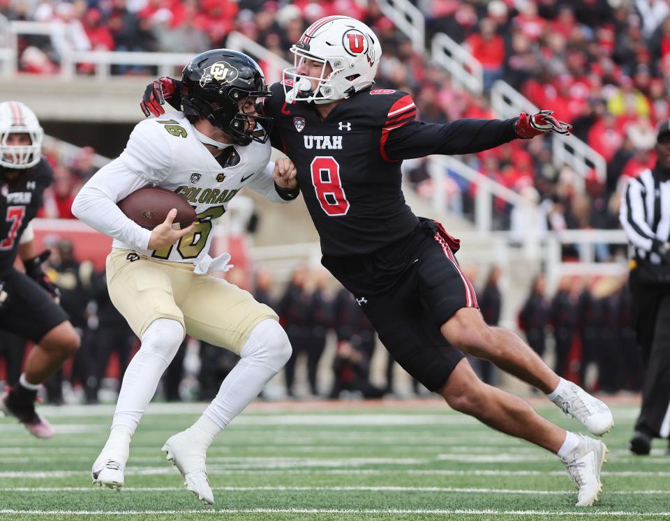 Utah Utes safety Cole Bishop (8) sacks Colorado Buffaloes quarterback Ryan Staub (16) in Salt Lake City on Saturday, Nov. 25, 2023. | Jeffrey D. Allred, Deseret News