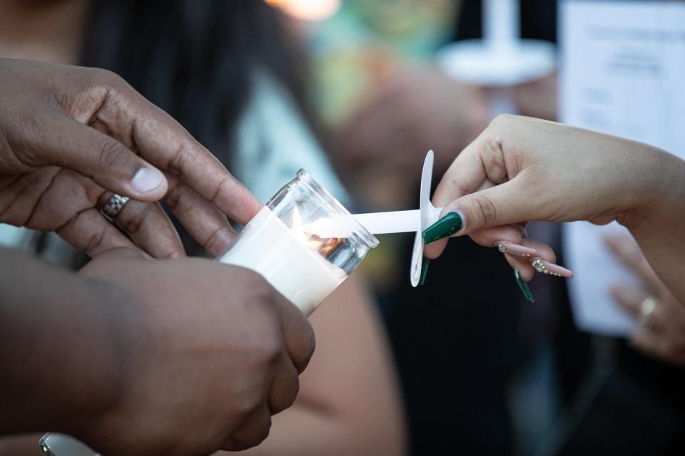 Mourners gather at Heritage Park during a candlelight vigil for Ray High School seniors Marcello Saldua and Matthew Garcia, on Thursday, June 2, 2022, in Corpus Christi, Texas. 