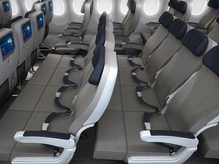 A view across two rows of Skycouches across a Azul Brazilian Airlines flight.