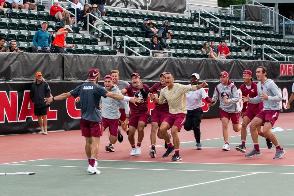 The FSU men's tennis team celebrates after knocking off No. 11 Georgia in the second round of the 2022 NCAA Tournament.