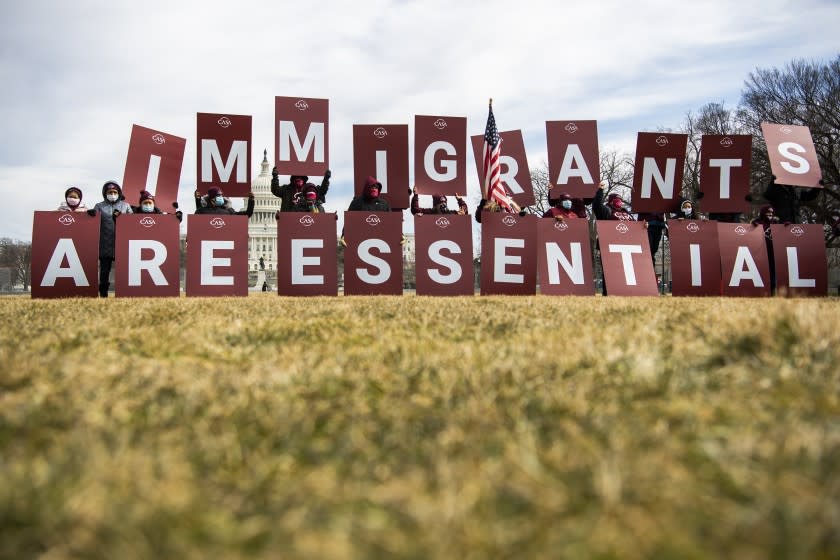 Food industry workers rally on the National Mall to highlight the contributions immigrants have made during the pandemic.