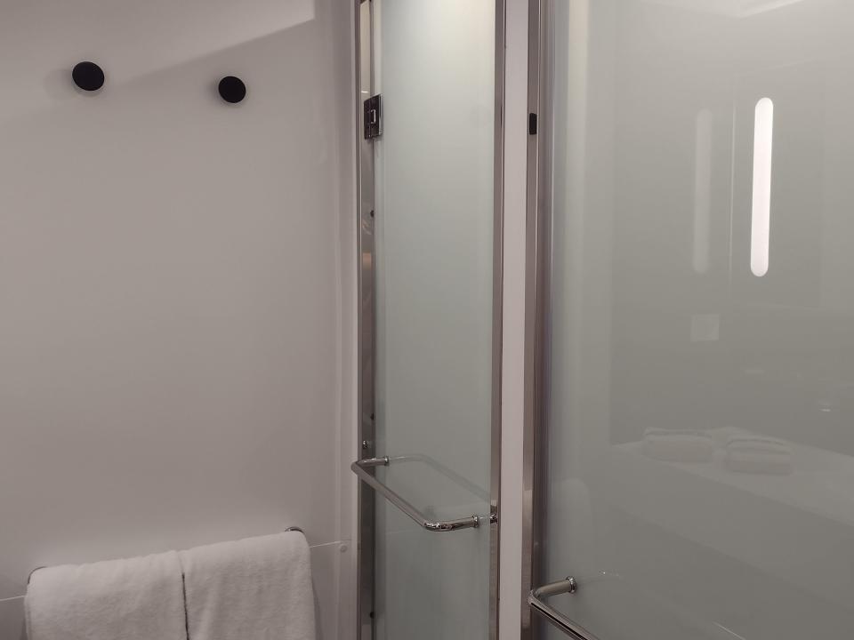 A bathroom with two opaque doors.