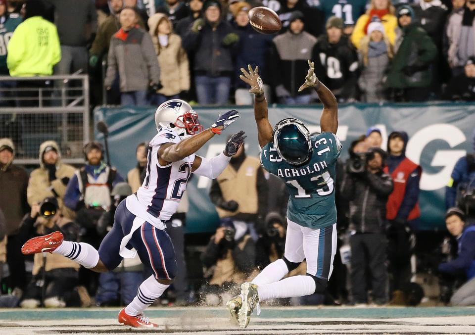 Philadelphia Eagles' Nelson Agholor (13) cannot catch a pass in the end zone against New England Patriots' J.C. Jackson (27) during the second half of an NFL football game, Sunday, Nov. 17, 2019, in Philadelphia. (AP Photo/Michael Perez) 
