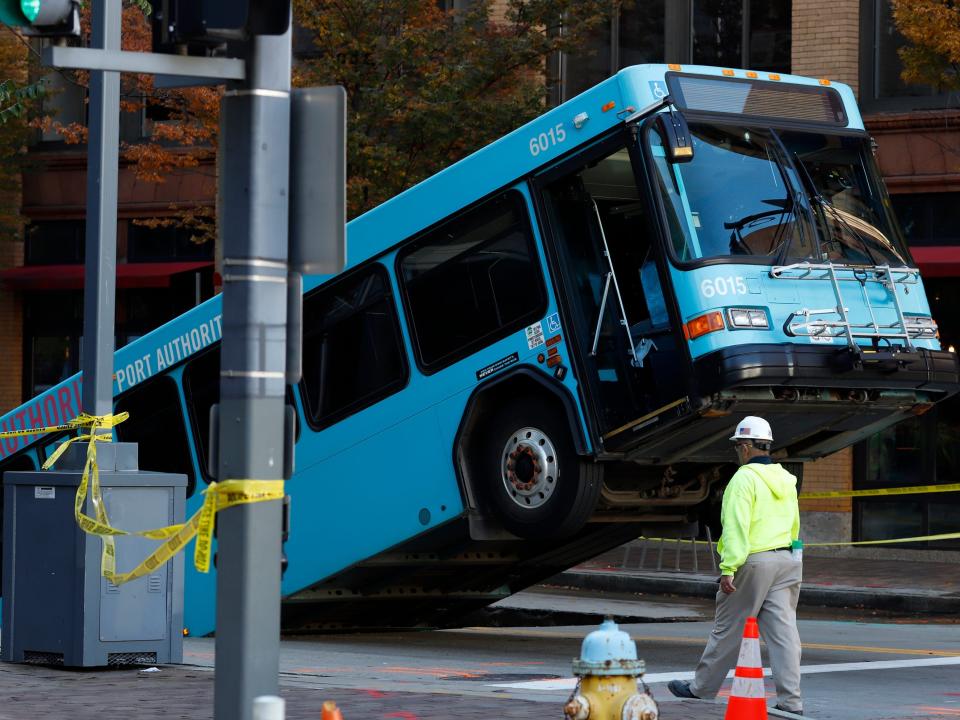 A commuter bus stuck in a sinkhole in Pittsburgh, Pennsylvania.