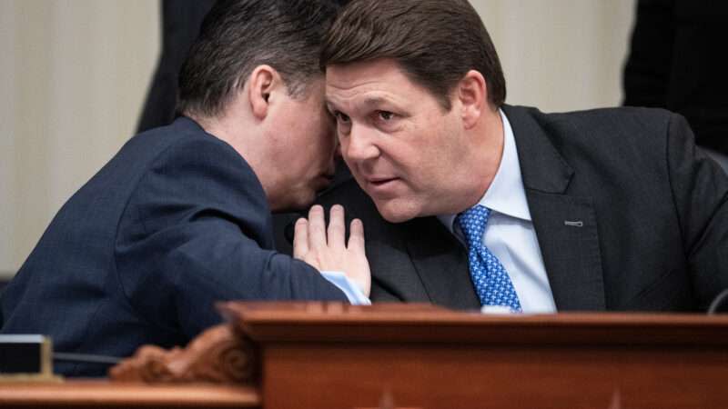 Rep. Jodey Arrington (right) and Rep. Brendan Boyle (left) talk during a House Budget Committee markup