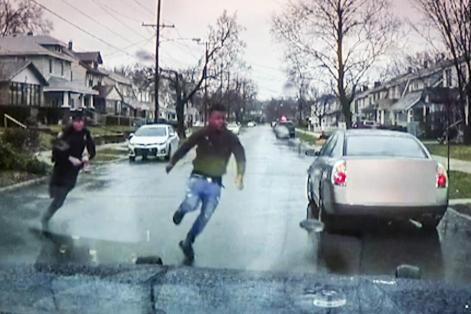 A TV display shows video evidence of a Grand Rapids police officer struggling with and shooting Patrick Lyoya at Grand Rapids City Hall on Wednesday, April 13, 2022. Lyoya, 26, was shot and killed about 8:10 a.m., on April 4, after what police said was a traffic stop. (Grand Rapids Police Department)