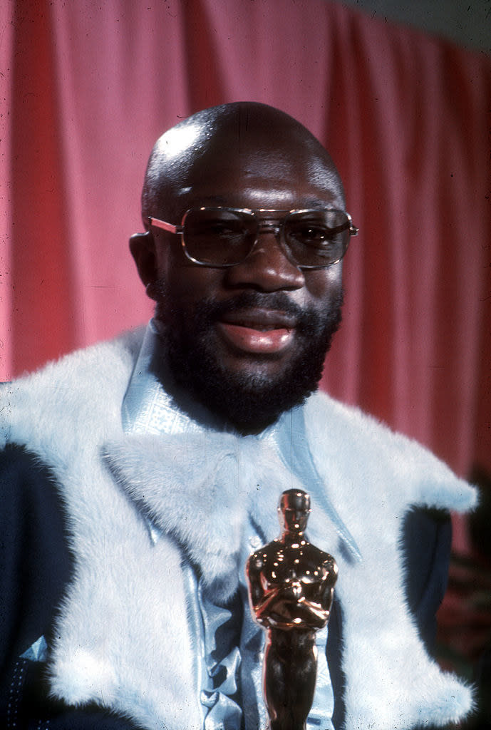 Hayes posing with his Oscar in the press room