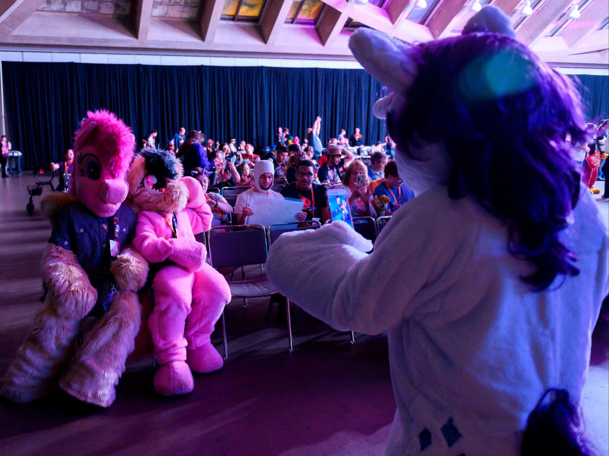 Fans are dressed as “My Little Pony” characters during the BronyCon convention, in Baltimore, Maryland on August 1, 2019. (AFP via Getty Images)