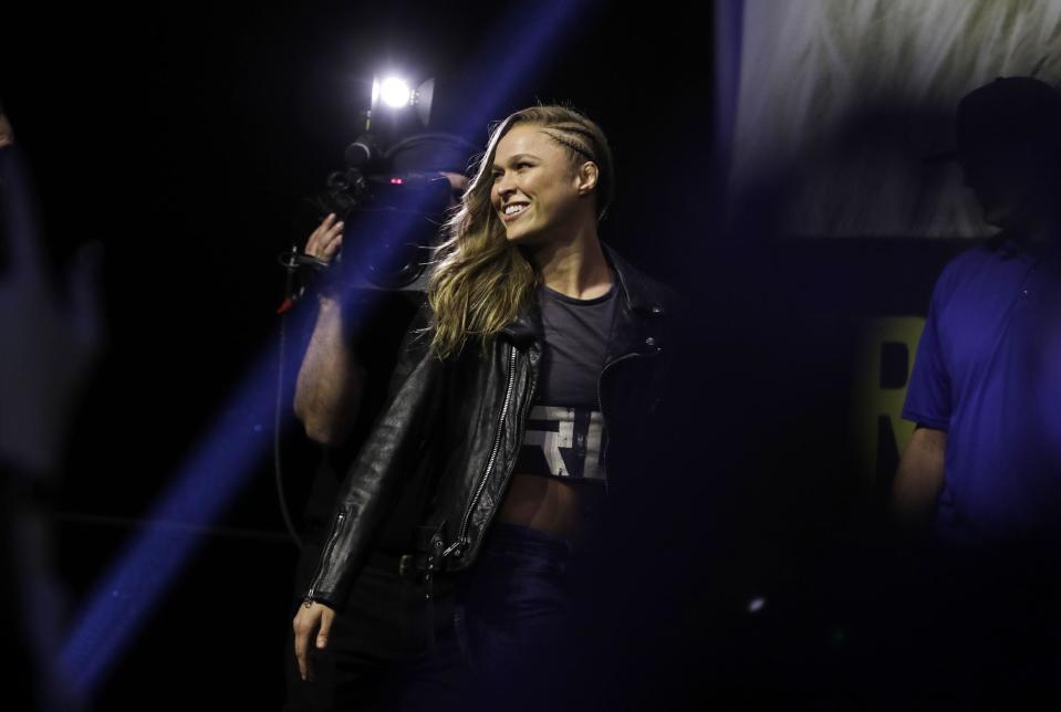 Ronda Rousey walks on stage during an event for UFC 207, Thursday, Dec. 29, 2016, in Las Vegas. Rousey is scheduled to fight Amanda Nunes in a mixed martial arts women's bantamweight championship bout Saturday in Las Vegas. (AP Photo/John Locher)