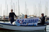 Fishermen hold a banner reading "SOS for Adriatic Sea" during a protest against undersea oil exploration in the Adriatic Sea in Bar, Montenegro, November 14, 2018. REUTERS/Stevo Vasiljevic