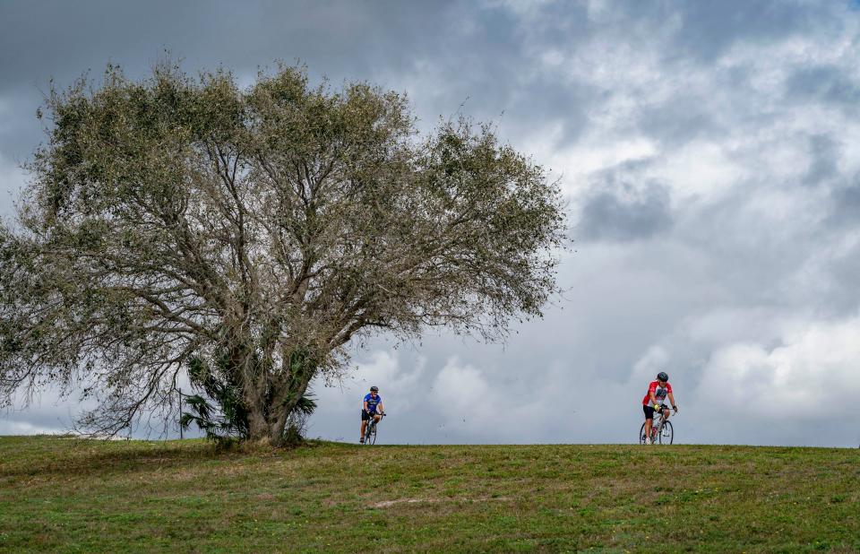 Cyclist rides the 2.2 mile Dyer Park Trail in West Palm Beach.