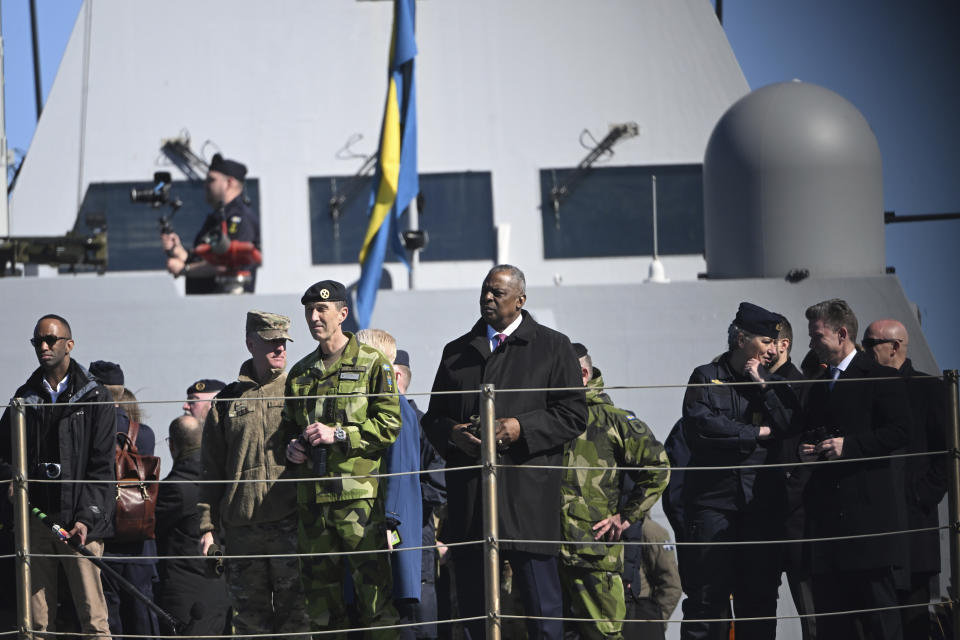 General Micael Bydén, Supreme Commander of the Swedish Armed Forces, and US Secretary of Defense, Lloyd J. Austin III, on board the Corvette HMS Härnösand (K33) at Muskö Naval Base, in Stockholm, Sweden, Wednesday, April 19, 2023. (Fredrik Sandberg/TT News Agency via AP)