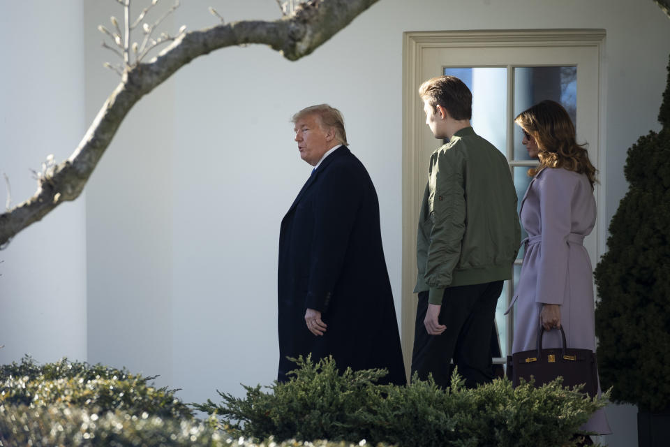 US President Donald Trump, first lady Melania Trump, and Barron Trump exit the Oval Office at the White House and walk toward Marine One on January 17, 2020 in Washington, DC. The Trump family is headed to Mar-a-Lago for the weekend.