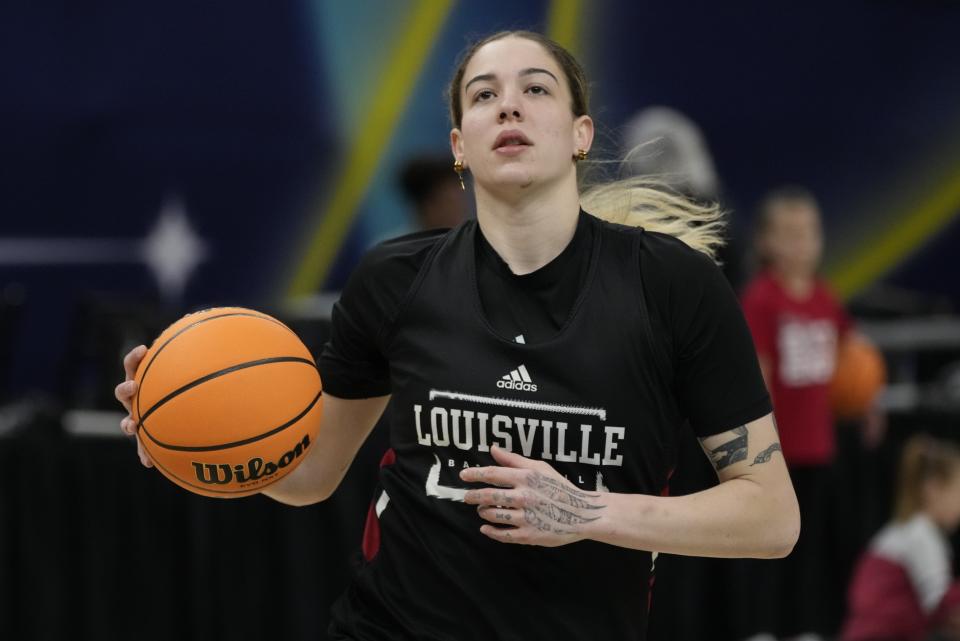 Louisville's Emily Engstler shoots during a practice session for a college basketball game in the semifinal round of the Women's Final Four NCAA tournament Thursday, March 31, 2022, in Minneapolis. (AP Photo/Charlie Niebergall)