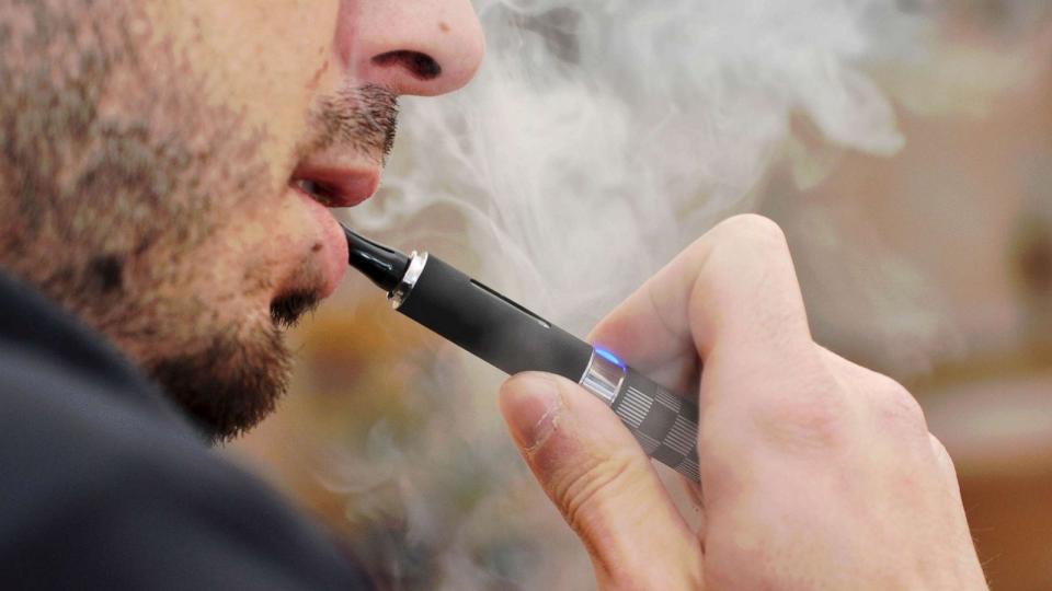 STOCK PHOTO: A man smokes an e-cigarettes (STOCK PHOTO/Getty Images)