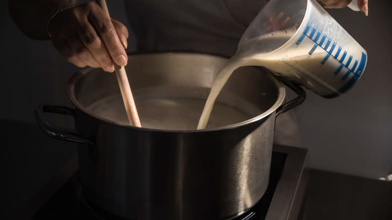 pouring milk in a pot