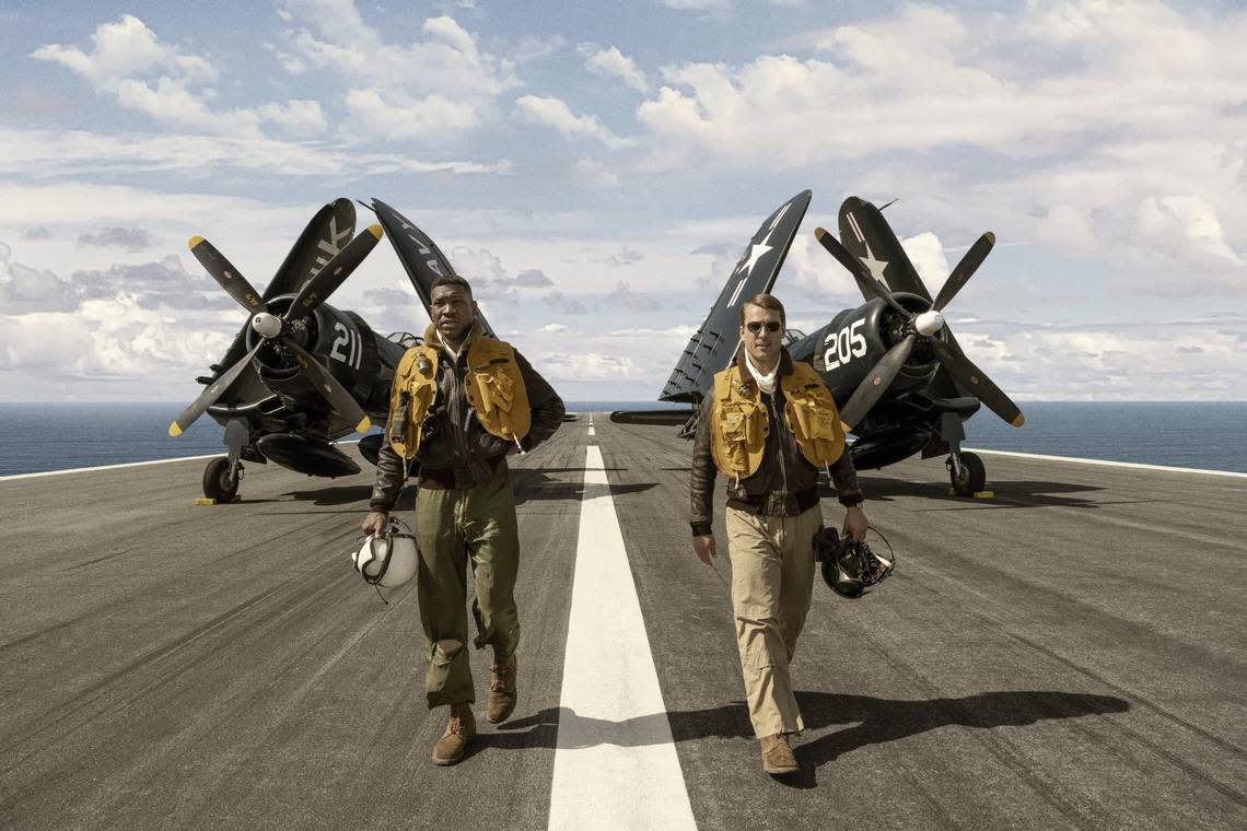 Jonathan Majors, left, and Glen Powell star in “Devotion,” an action-drama set during the Korean War about the U.S. Navy’s first Black aviator and his dedicated wingman.