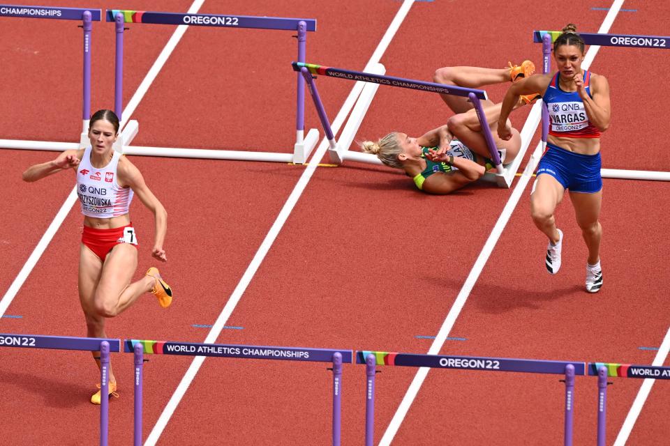 Liz Clay, pictured here falling in the 100m hurdles heats at the world championships.