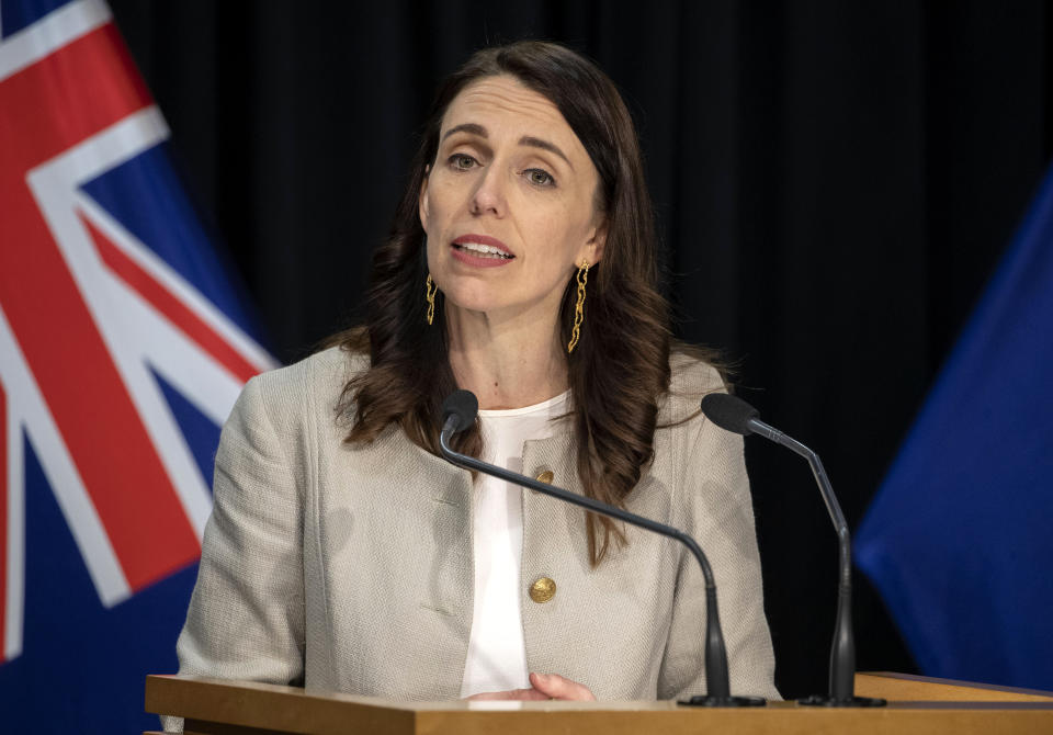 New Zealand Prime Minister Jacinda Ardern reacts during a press conference in Wellington, New Zealand, Friday, Aug. 14, 2020. Ardern announced that the three-day lockdown in Auckland would be extended by another 12 days at level 3, the rest of New Zealand will stay at level 2 restrictions as health authorities investigate the source of the first domestic coronavirus outbreak in more than three months. (Mark Mitchell/New Zealand Herald via AP)