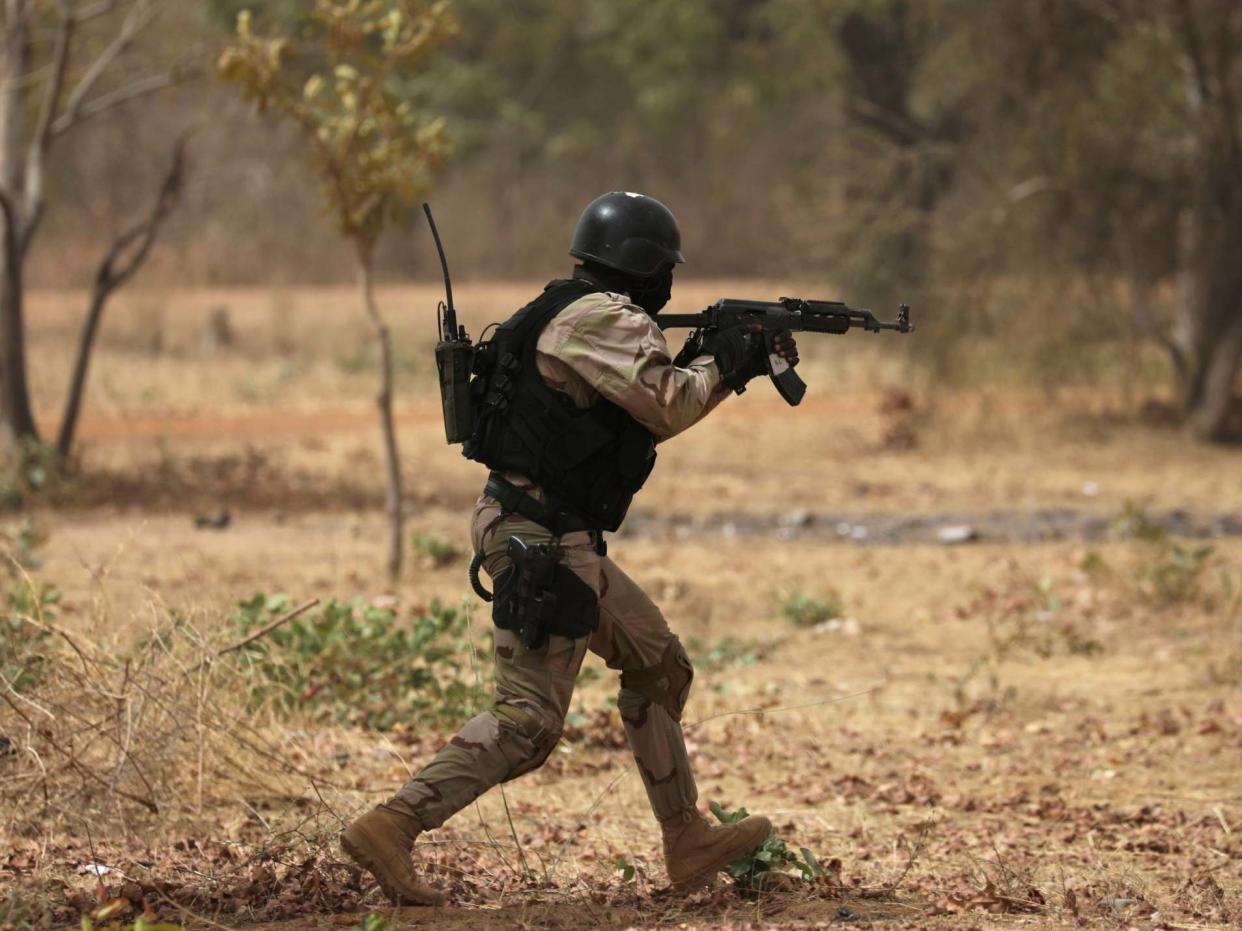 A soldier from Burkina Faso participates in a simulated raid during the US sponsored Flintlock exercises: REUTERS