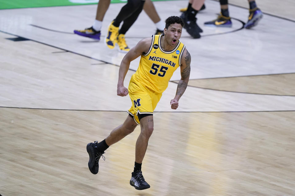 Michigan guard Eli Brooks celebrates after making a 3-point basket during the second half of a second-round game against LSU in the NCAA men's college basketball tournament at Lucas Oil Stadium Monday, March 22, 2021, in Indianapolis. (AP Photo/Darron Cummings)