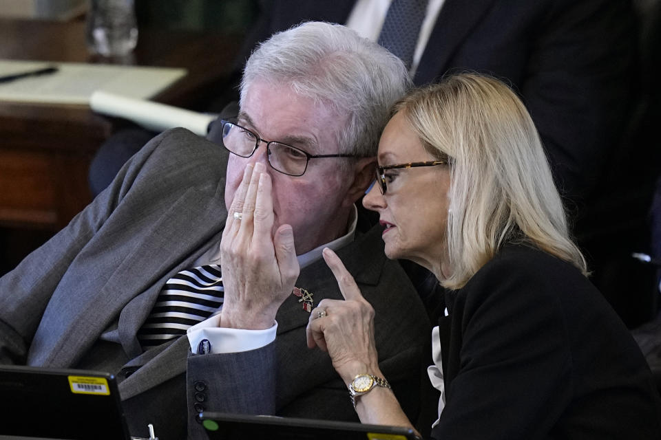 Texas Lt. Gov. Dan Patrick, left, talks with legal counsel Lana Myers, right, during day three of the impeachment trial for Texas Attorney General Ken Paxton in the Senate Chamber at the Texas Capitol, Thursday, Sept. 7, 2023, in Austin, Texas. (AP Photo/Eric Gay)