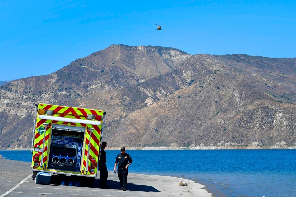 Emergency services workers at the scene (AFP via Getty Images)