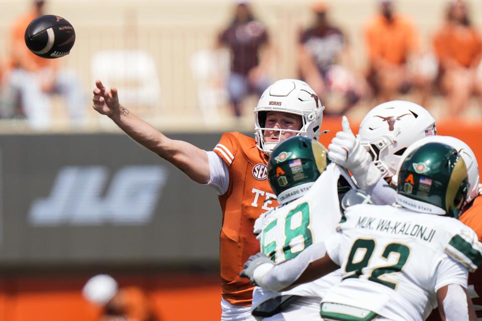 Texas quarterback Quinn Ewers fires as pass the Texas Longhorns take on Colorado State at Royal-Memorial Stadium in Austin on Saturday. Ewers three three touchdown passes in the first half to give the Longhorns a big lead.