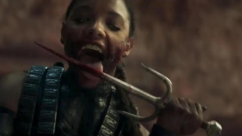 Sisi Stringer as Mileena licks her iconic Sai in the Mortal Kombat movie