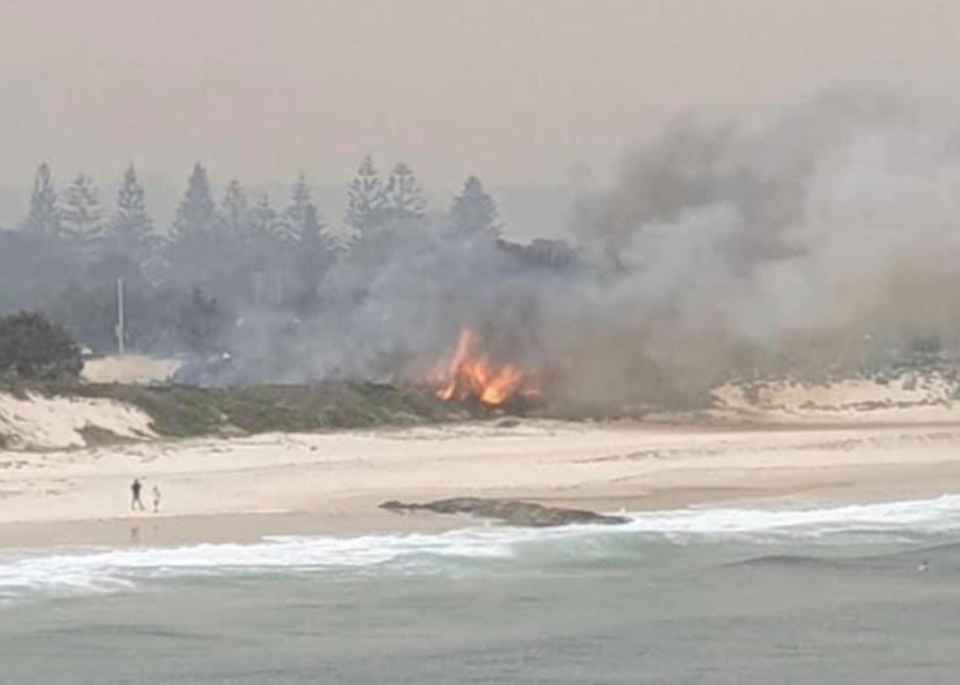 A fire shown burning at Forster's main beach in NSW.