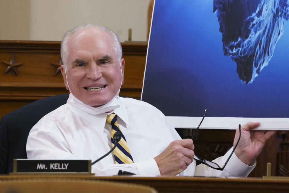 FILE - In this Sept. 9, 2021, file photo Rep. Mike Kelly, R-Pa., uses an iceberg as a metaphor as he warns the House Ways and Means Committee of the dangers of increasing debt if the Democrats' Build Back Better Act is passed, during a markup at the Capitol in Washington. A congressional ethics watchdog has concluded there is “substantial reason to believe” that Kelly's wife used nonpublic information gained through her husband's position in Congress to purchase stock last year, a likely violation of federal law and House rules. (AP Photo/J. Scott Applewhite, File)