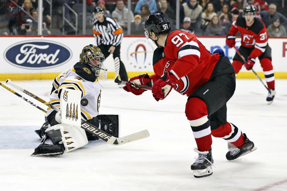 Boston Bruins goaltender Jaroslav Halak (41) blocks a shot by New Jersey Devils left wing Nikita Gusev (97) during the second period of an NHL hockey game, Tuesday, Dec. 31, 2019, in Newark, N.J. (AP Photo/Kathy Willens)