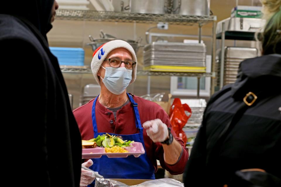 Ted Patek serves those attending St. Ben’s Community Meal. This is Patek's fifth year volunteering.