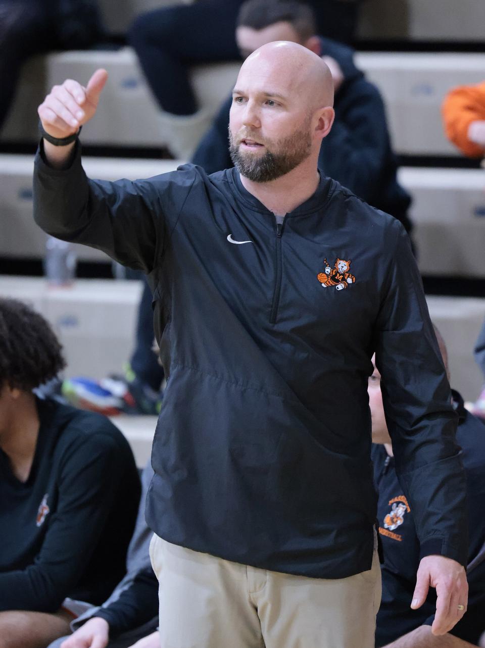 Massillon basketball coach Josh Hose signals to his players during Wednesday's game against Hudson.