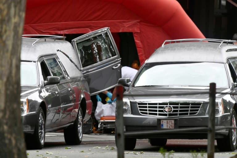 Hearses came to the scene of the shooting in Liege, where the attacker shot dead three people