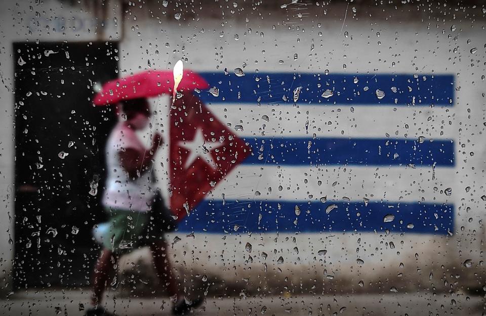 A woman walks through Havana, Cuba, January 12, 2021. / Credit: YAMIL LAGE/AFP/Getty